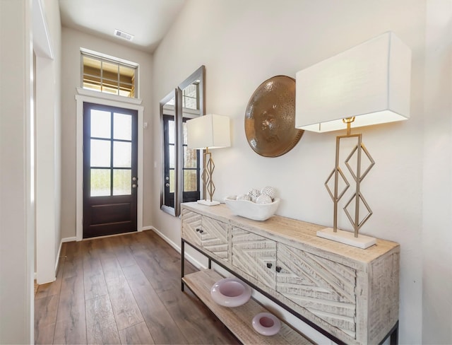 entryway with dark hardwood / wood-style flooring