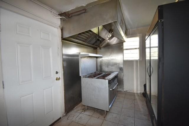 kitchen featuring black refrigerator