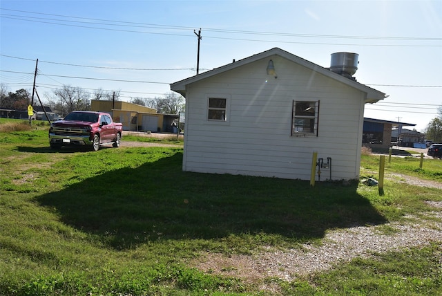 view of home's exterior with a lawn