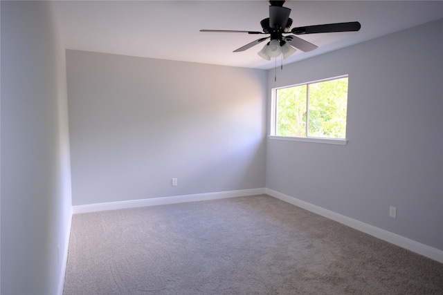 empty room with carpet and ceiling fan