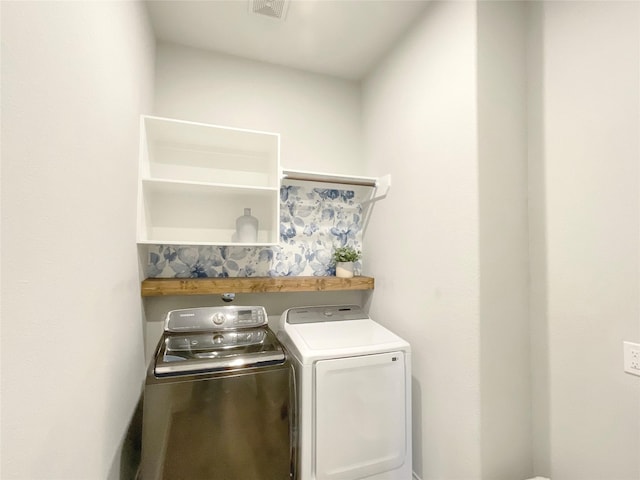 laundry area with separate washer and dryer