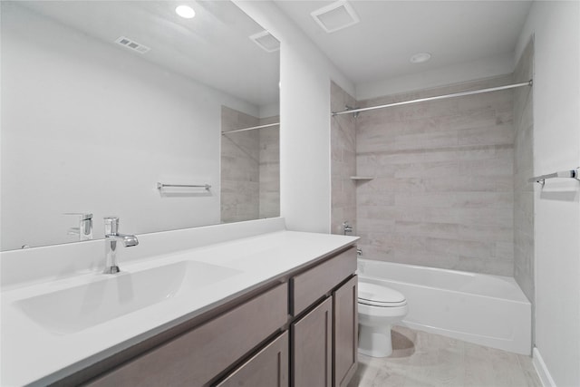 full bathroom with vanity, toilet, and tiled shower / bath combo