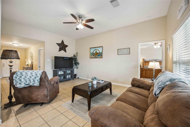 living room featuring ceiling fan and light tile patterned floors