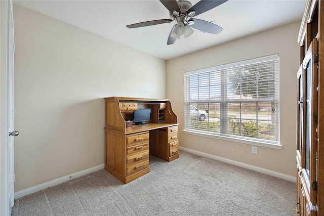 carpeted home office with ceiling fan