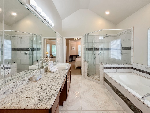 bathroom featuring vanity, high vaulted ceiling, and shower with separate bathtub