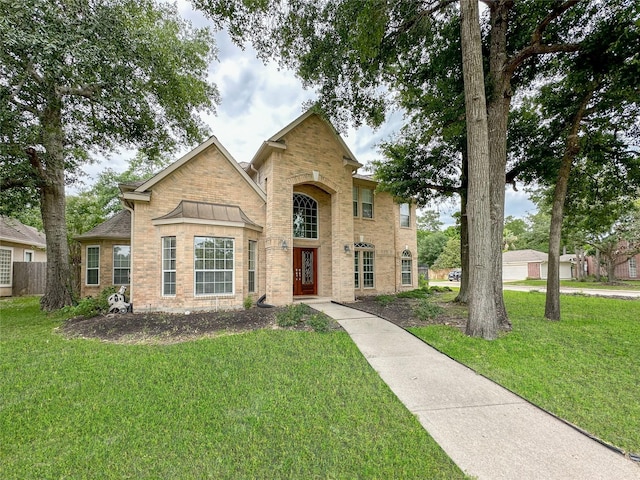 view of front of home with a front lawn