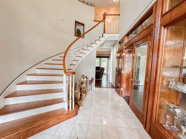 entrance foyer with a towering ceiling