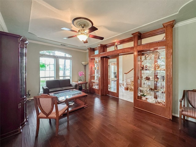 sitting room featuring french doors, dark hardwood / wood-style flooring, ceiling fan, and crown molding