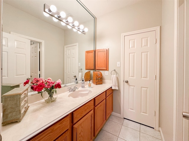 bathroom with tile patterned floors and vanity