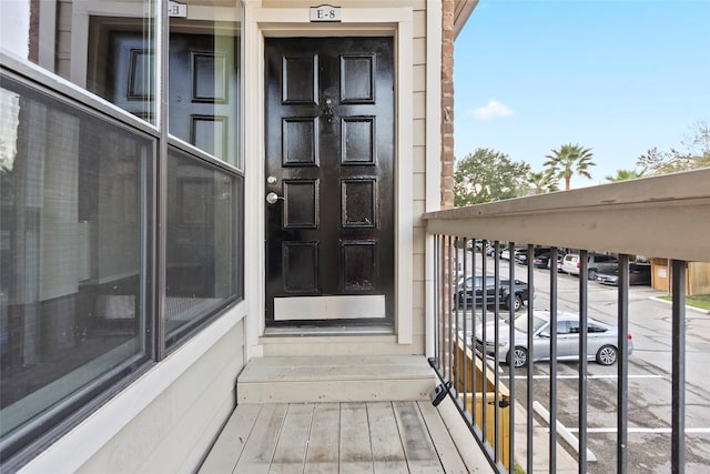 entrance to property with a balcony