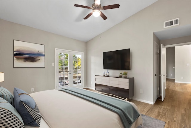 bedroom featuring access to outside, ceiling fan, high vaulted ceiling, and light hardwood / wood-style floors