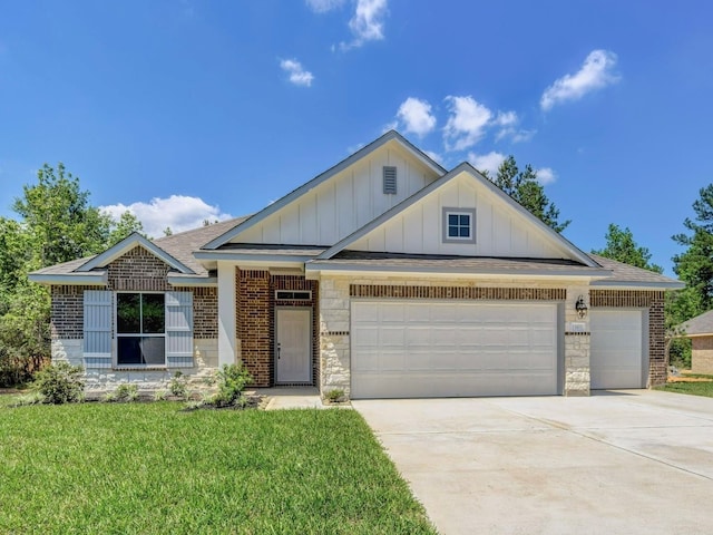 view of front facade with a front yard and a garage