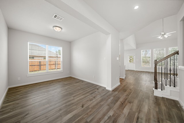 empty room featuring ceiling fan, dark hardwood / wood-style floors, and lofted ceiling