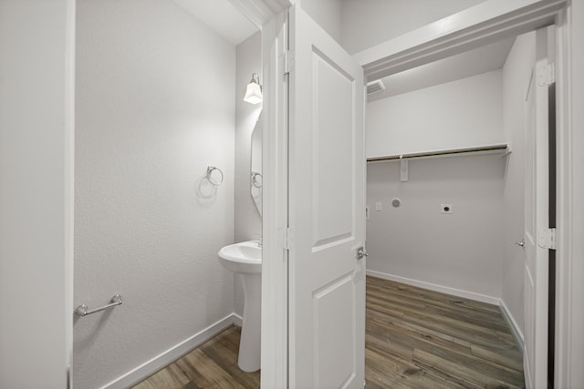 bathroom with hardwood / wood-style flooring