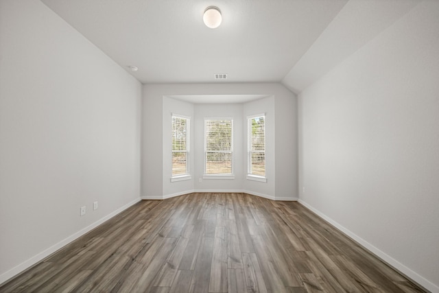 unfurnished room with dark hardwood / wood-style floors