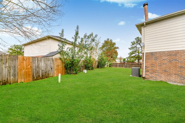 view of yard featuring central AC