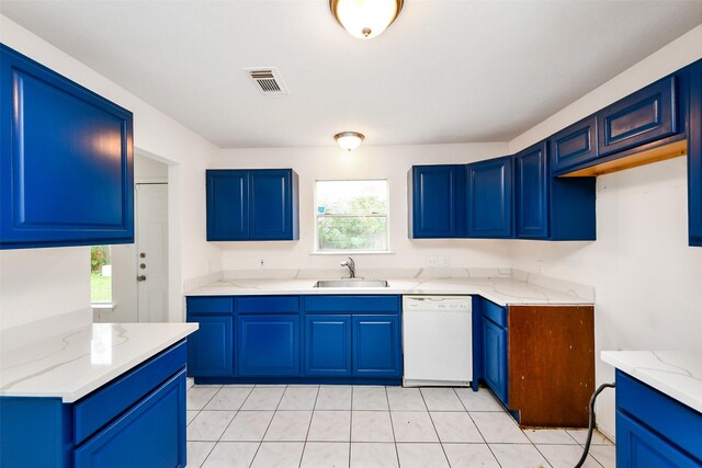 kitchen featuring blue cabinetry, white dishwasher, and sink