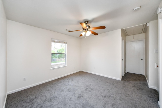 carpeted spare room featuring ceiling fan