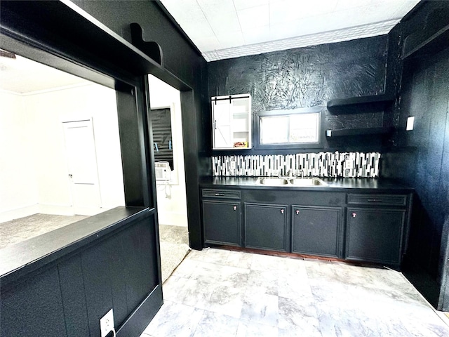 interior space with sink and crown molding