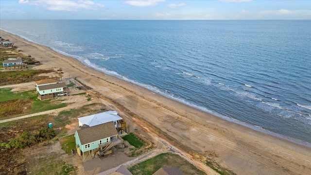 bird's eye view with a water view and a view of the beach