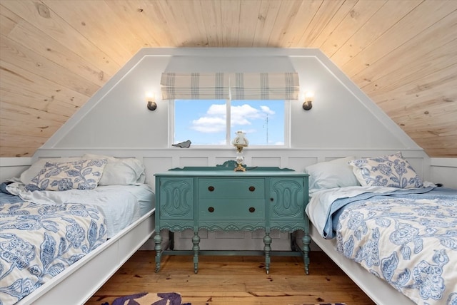 bedroom with wood-type flooring, wood ceiling, and vaulted ceiling