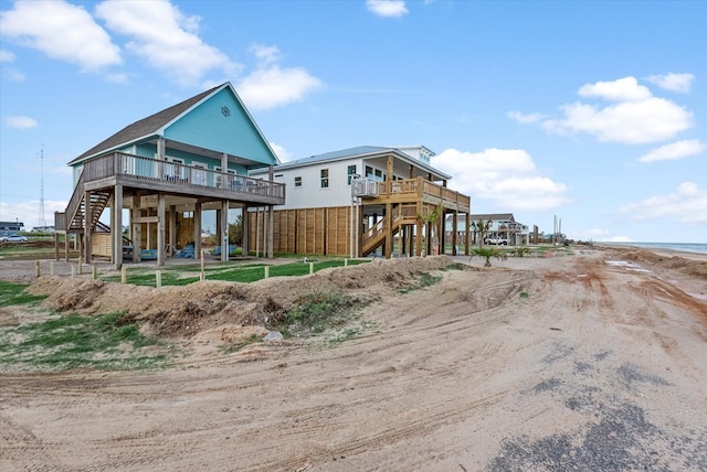 back of property with a wooden deck