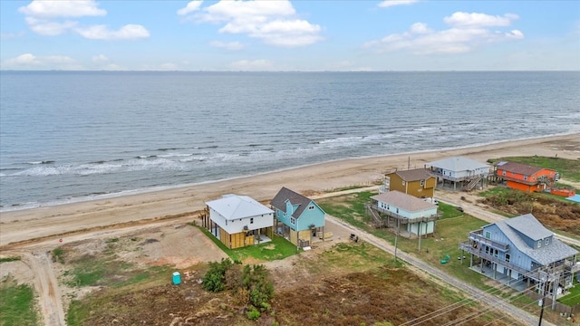 birds eye view of property featuring a water view and a view of the beach