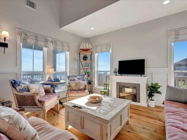 living room featuring plenty of natural light and light wood-type flooring