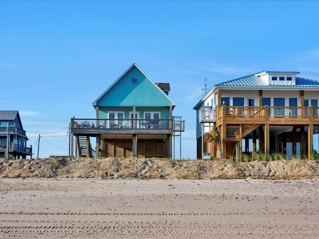 back of property featuring a wooden deck