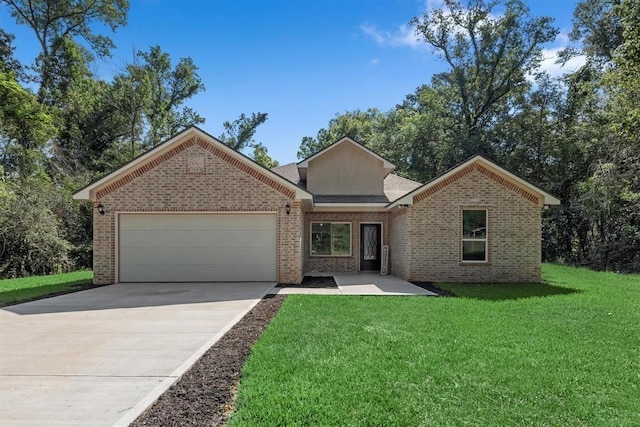 view of front of property featuring a garage and a front lawn