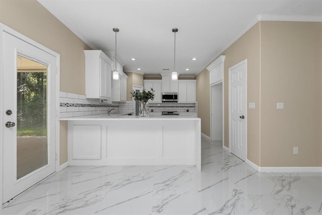 kitchen with kitchen peninsula, white cabinetry, crown molding, and pendant lighting