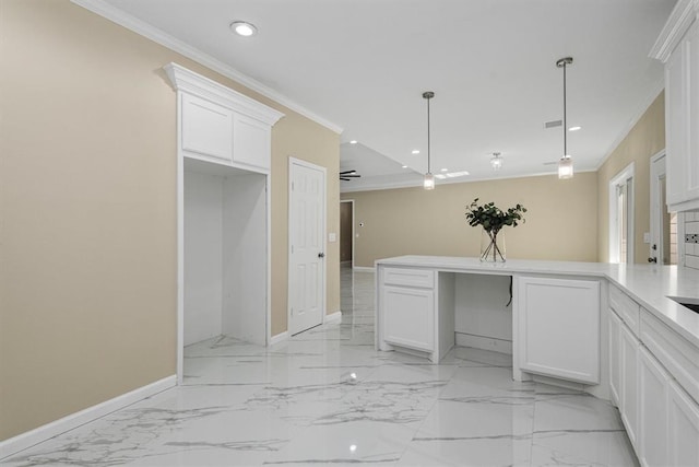 kitchen with white cabinets, ceiling fan, and crown molding