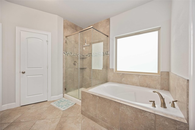 bathroom featuring tile patterned flooring and plus walk in shower