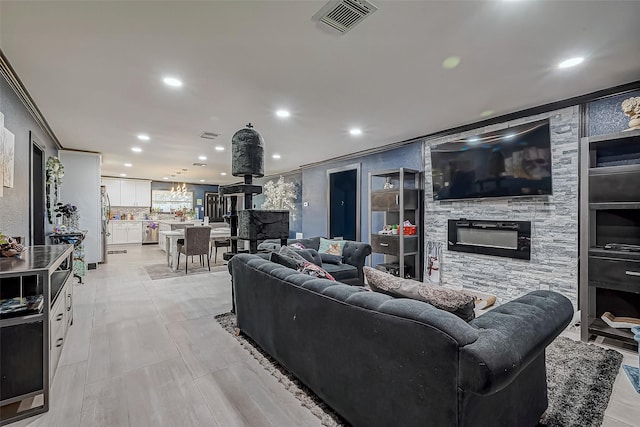 606 S Kaufman Dr, Deer Park, TX 77536 - living area with recessed lighting, visible vents, ornamental molding, and a stone fireplace
