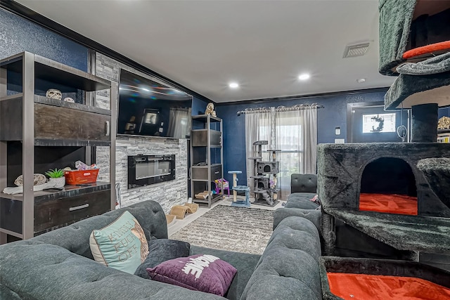 606 S Kaufman Dr, Deer Park, TX 77536 - living area featuring recessed lighting, visible vents, crown molding, and a stone fireplace