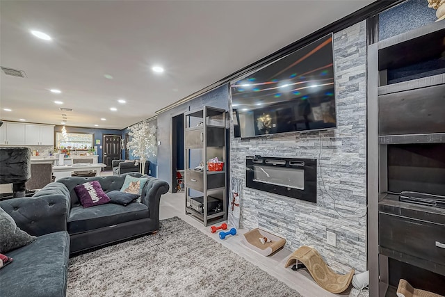 606 S Kaufman Dr, Deer Park, TX 77536 - living area with recessed lighting, visible vents, and a glass covered fireplace