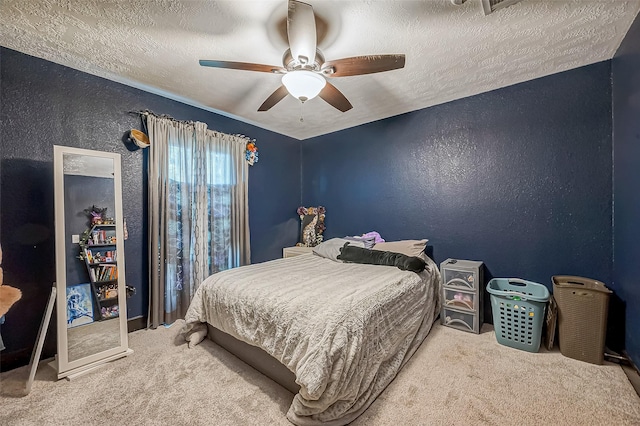 606 S Kaufman Dr, Deer Park, TX 77536 - bedroom with a textured ceiling, a textured wall, carpet flooring, and a ceiling fan