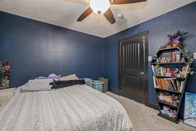 606 S Kaufman Dr, Deer Park, TX 77536 - bedroom featuring a ceiling fan, carpet flooring, a textured ceiling, and a textured wall