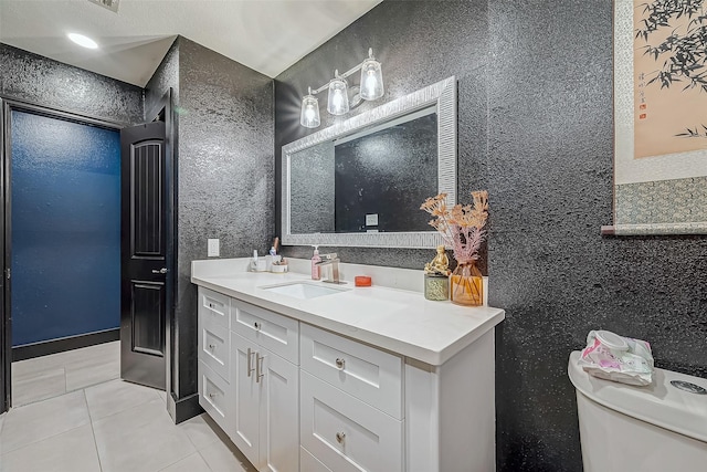 606 S Kaufman Dr, Deer Park, TX 77536 - bathroom featuring tile patterned flooring, vanity, and toilet