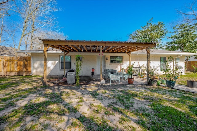 606 S Kaufman Dr, Deer Park, TX 77536 - rear view of property with brick siding and fence