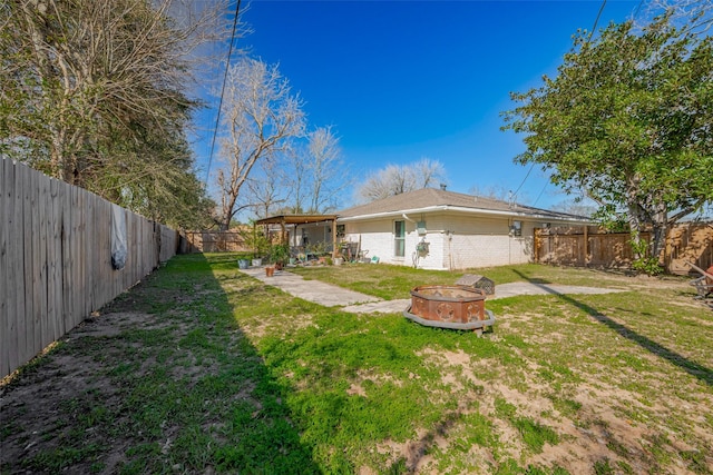 606 S Kaufman Dr, Deer Park, TX 77536 - view of yard with a fire pit, a patio area, and a fenced backyard