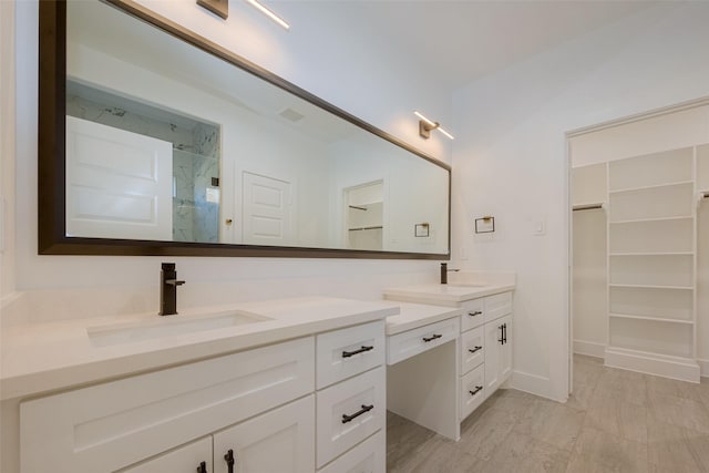 bathroom with vanity and walk in shower