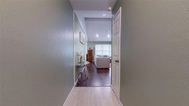 hallway with dark wood-type flooring