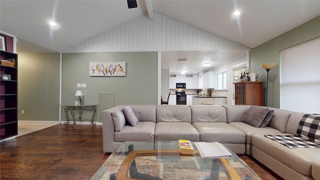 living room featuring hardwood / wood-style flooring and vaulted ceiling