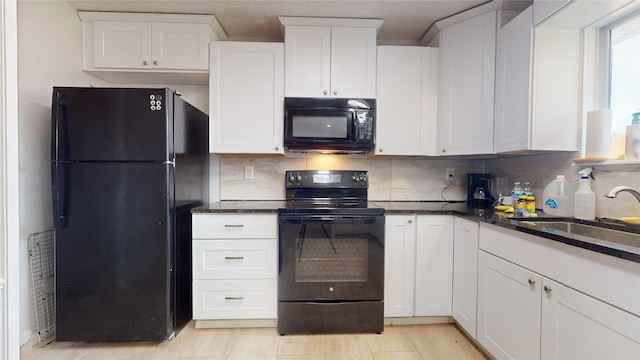 kitchen with backsplash, white cabinetry, and black appliances