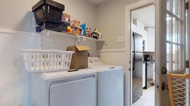 clothes washing area with washer and dryer