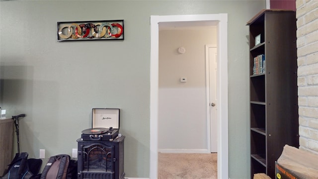 corridor featuring light colored carpet