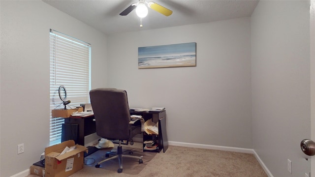 office space with carpet floors and ceiling fan