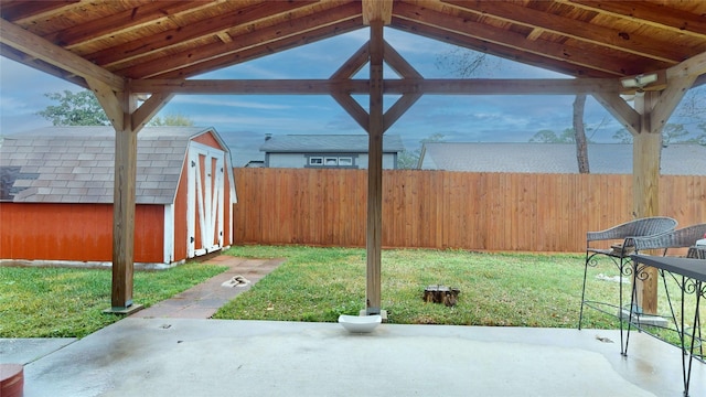 view of patio featuring a storage unit