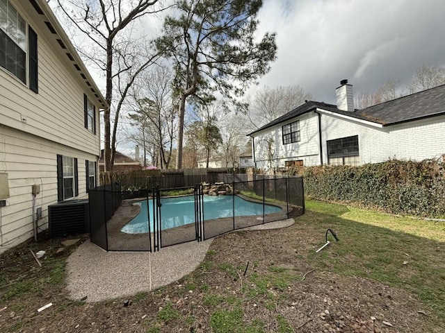 view of pool featuring a lawn and a patio area